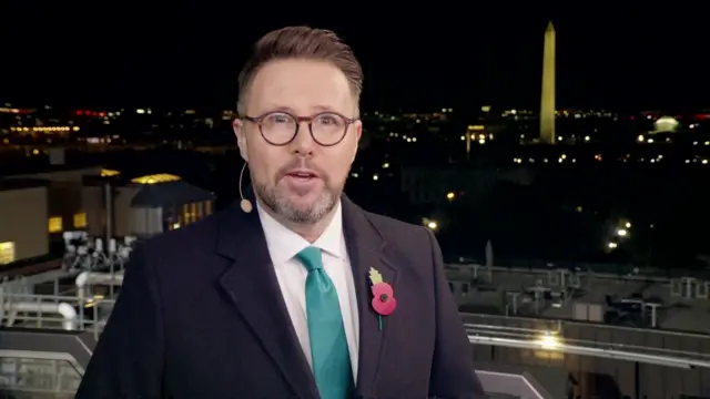 Jon Kay in Washington with the Washington monument in the background