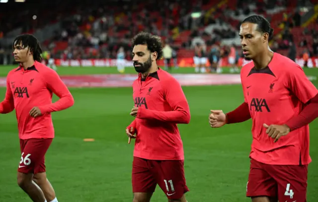 Trent Alexander-Arnold of Liverpool and Virgil van Dijk of Liverpool with Mohamed Salah of Liverpool