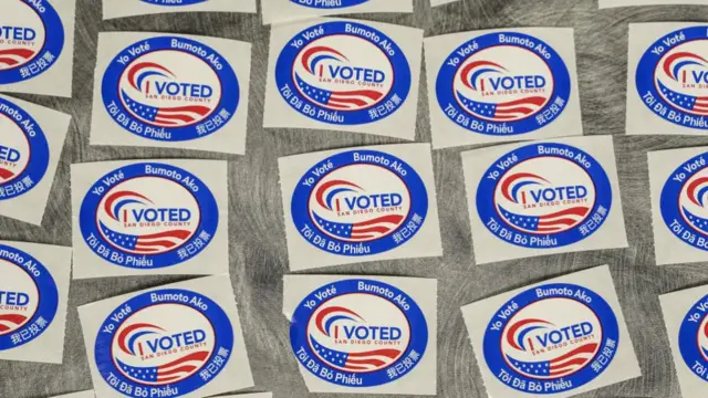 "I voted" stickers are seen on a table at the vote centre in San Diego County, California