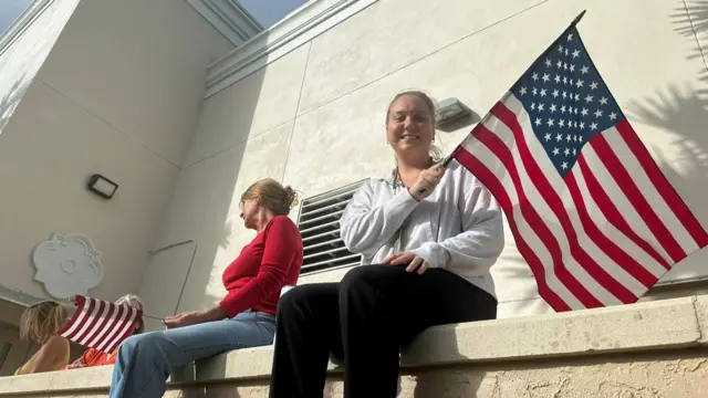 Trump supporters in Flordia waving a US flag