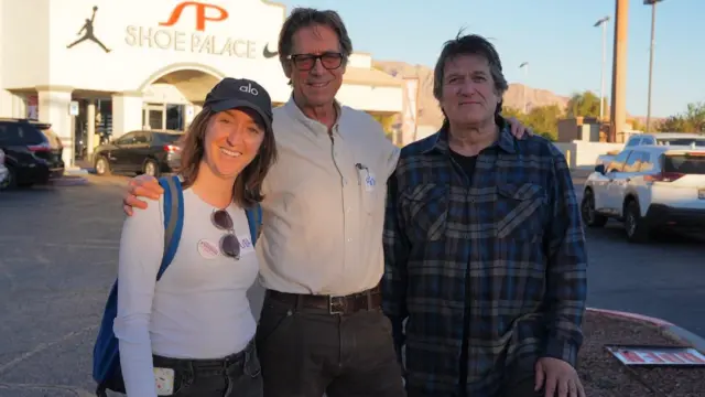 Laura Ponchick, Peter Brock and Jim Barton (all from California canvassing in East Las Vegas) stand in a line