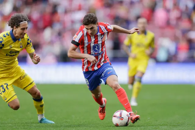 Julian Alvarez dribbling with the ball