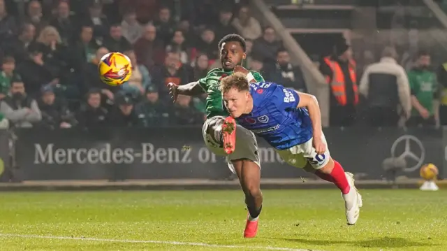 Portsmouth's Matt Ritchie sends a diving header towards the Plymouth goal