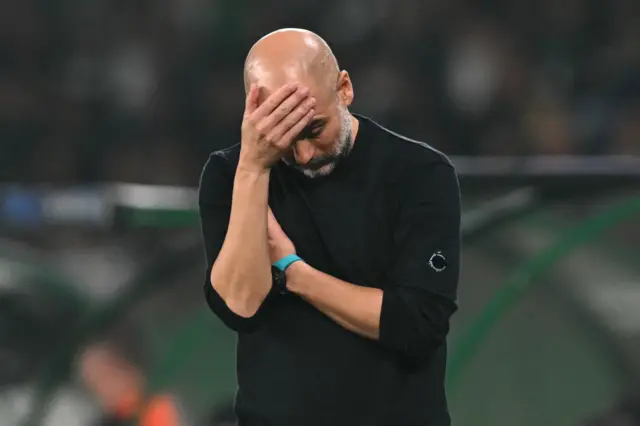 Guardiola puts his hand to his head