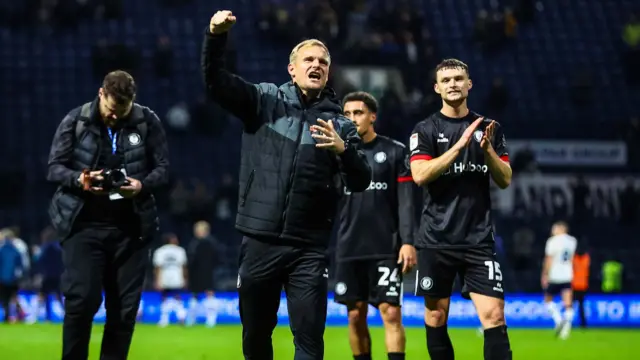 Bristol City head coach Liam Manning celebrates victory at Preston North End