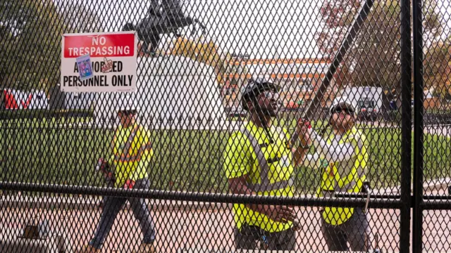 Workers erect security fencing near the White House