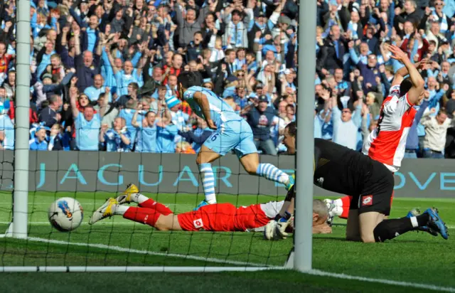 Sergio Aguero peels away after scoring a dramatic late winner at home to QPR to seal the 2012 Premier League title for Manchester City