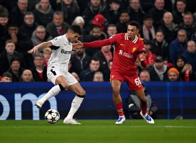 Alexander-Arnold tries to dispossess a Leverkusen player