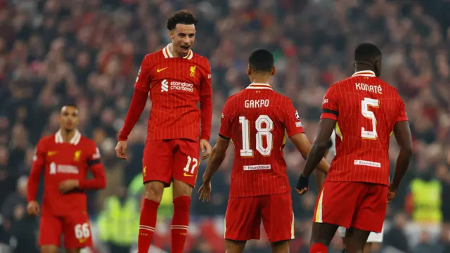 Liverpool players celebrate after their second goal