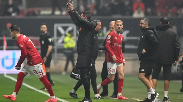 Bristol City's Mark Sykes is forced off at Ashton Gate with an injury and is replaced by Anis Mehmeti