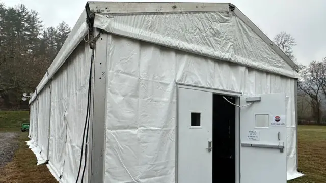 A white tent in a field