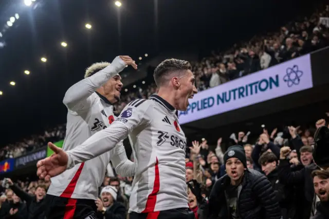 Harvey Wilson celebrates with Fulham fans