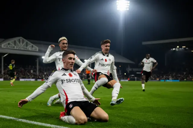 Scorer Harvey Wilson celebrates