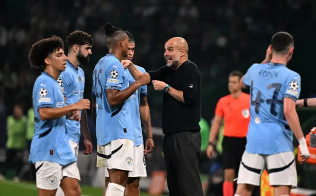 Pep talks to his players on the touchline