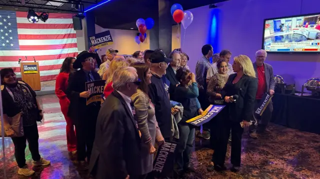 People celebrating at a Trump watch party