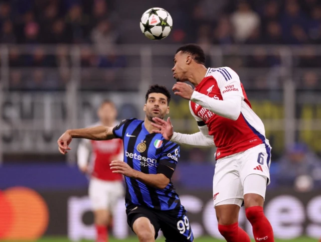 Inter Milan's Mehdi Taremi in action with Arsenal's Gabriel Magalhaes