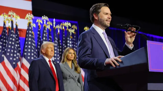 Republican vice-presidential nominee JD Vance speaks as president-elect Donald Trump and his wife Melania watch in West Palm Beach, Florida. Photo: 6 November 2024