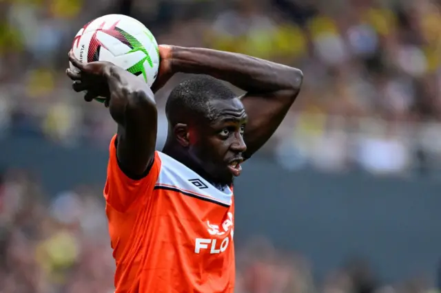 Lorient's French defender #05 Benjamin Mendy throws the ball