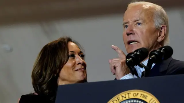 Vice President Kamala Harris looks at U.S. President Joe Biden