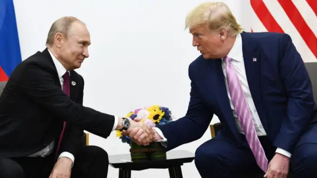 US President Donald Trump (R) meets Russian President Vladimir Putin (L) on the first day of the G20 summit in Osaka, Japan on June 28, 2019