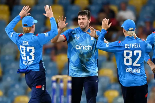 Jamie Overton of England celebrates dismissing Evin Lewis