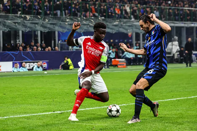 Bukayo Saka of Arsenal FC dribbles the ball