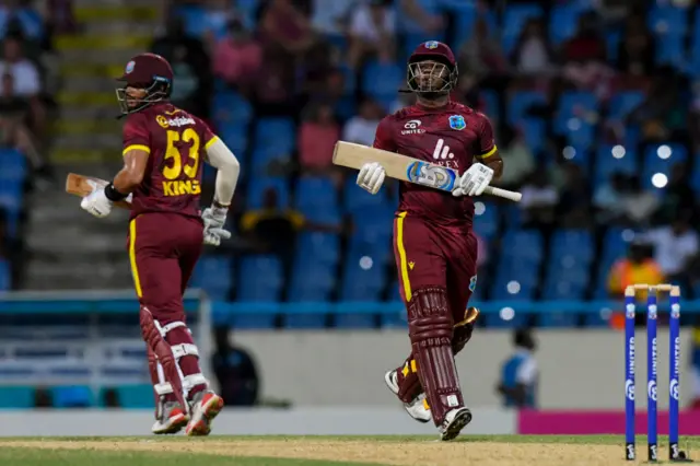 Evin Lewis and Brandon King of West Indies in action