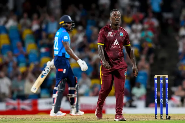 Sherfane Rutherford of West Indies expresses disappointment after Jofra Archer of England hits four