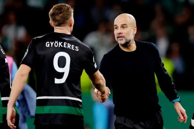 Viktor Gyokeres shakes the hand of Pep Guardiola