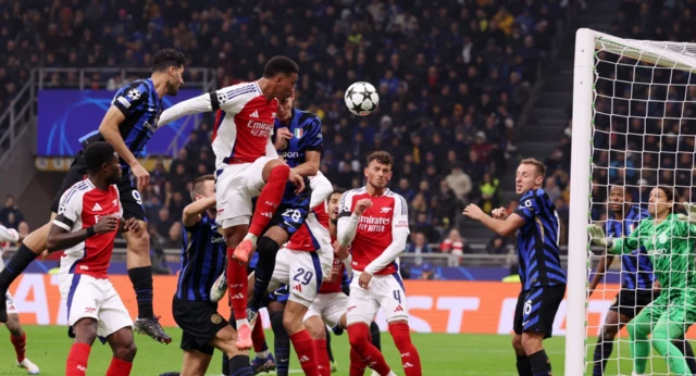 Arsenal's Gabriel Magalhaes heads at goal