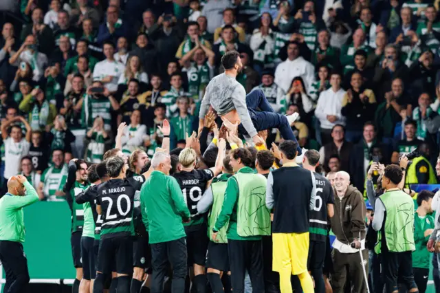 Ruben Amorim is hoisted on the shoulders of Sporting players in front of fans