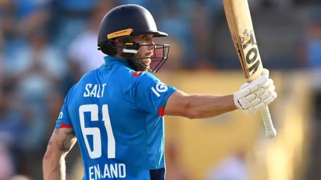 Phil Salt of England salutes the crowd after reaching his half century