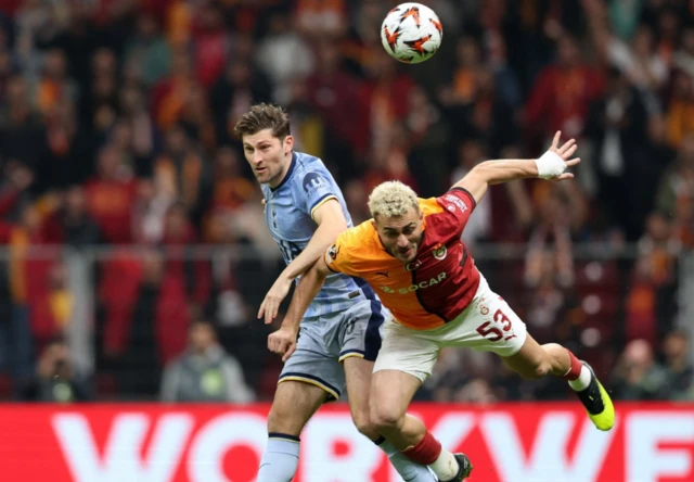 Galatasaray's Baris Alper Yilmaz in action with Tottenham Hotspur's Ben Davies