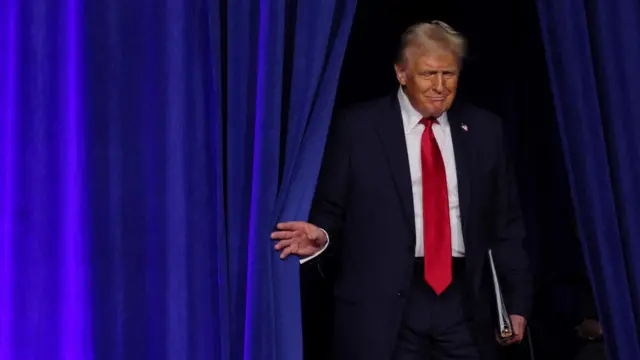 Republican presidential nominee and former U.S. President Donald Trump takes the stage for his election night rally at the Palm Beach County Convention Center in West Palm Beach, Florida, U.S., November 6, 2024