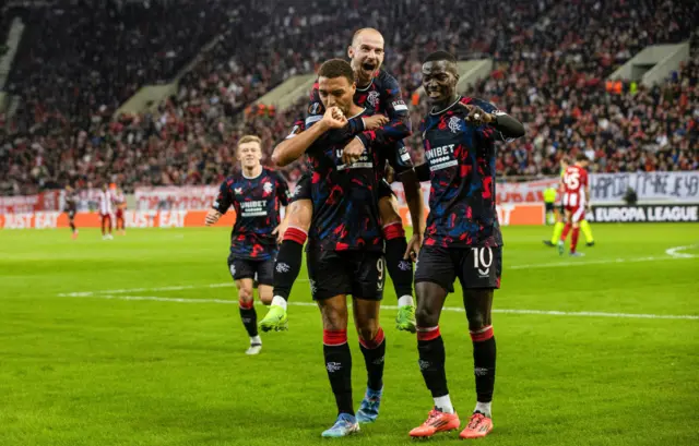 ATHENS, GREECE - NOVEMBER 07: Rangers' Cyriel Dessers celebrates with Vaclav Cerny and Mohamed Diomande as he scores to make it 1-1 during a UEFA Europa League 2024/25 League Phase MD4 match between Olympiacos and Rangers at The Georgios Karaiskakis Stadium, on November 07, 2024, in Athens, Greece. (Photo by Alan Harvey / SNS Group)