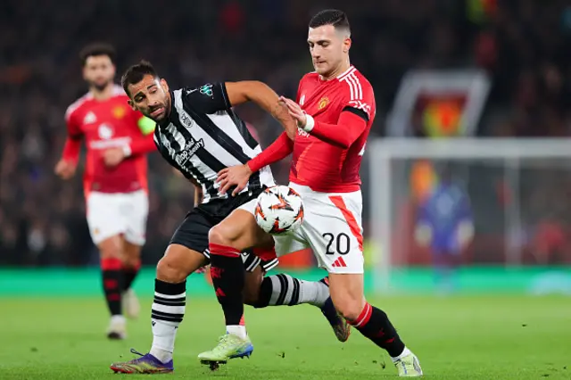 Diogo Dalot of Manchester United battles for possession with Jonny Otto