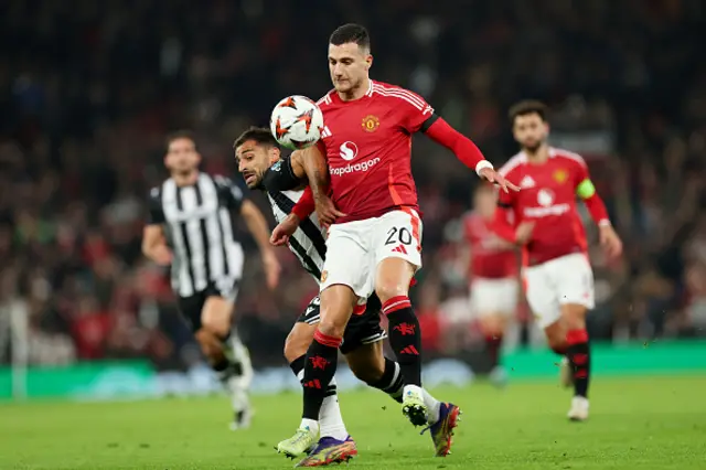 Jonny of PAOK FC and Diogo Dalot of Manchester United compete