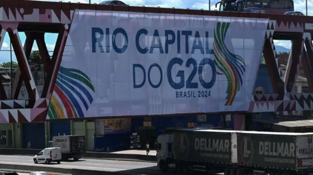 A G20 Summit banner is seen from the Brazil Avenue, north zone of Rio de Janeiro