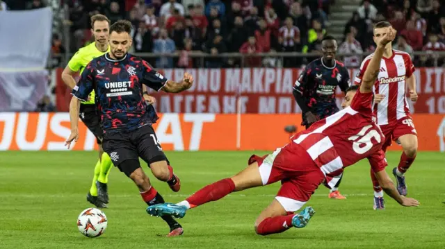 ATHENS, GREECE - NOVEMBER 07: Rangers' Nedim Bajrami and Olympiacos' David Carmo in action during a UEFA Europa League 2024/25 League Phase MD4 match between Olympiacos and Rangers at The Georgios Karaiskakis Stadium, on November 07, 2024, in Athens, Greece. (Photo by Alan Harvey / SNS Group)