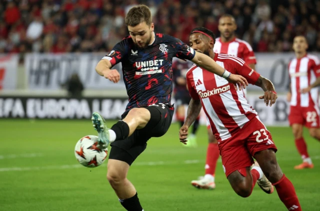 Rangers' Nicolas Raskin in action with Olympiacos' Rodinei