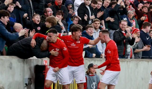 Description Larne's Jordan McEneff celebrates their side's first goal