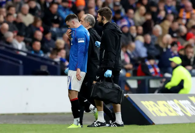 Tom Lawrence pulls his shirt over his face as he walks off the field