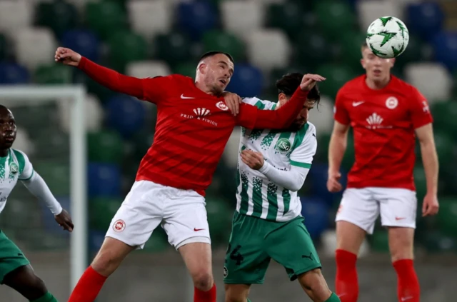 Larne's Chris Gallagher (left) and St. Gallen's Bastien Toma (right) battle for the ball