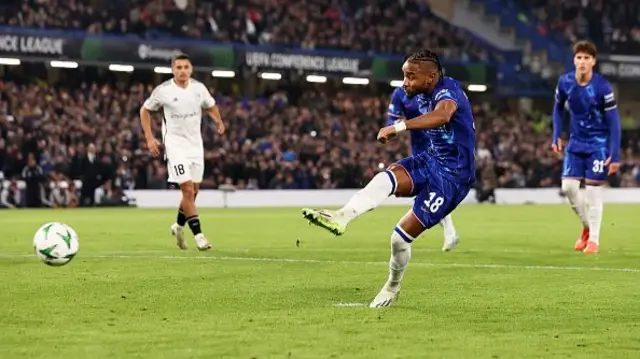 Christopher Nkunku of Chelsea scores his team's eighth goal