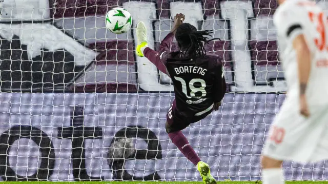 Hearts' Malachi Boateng makes a goalline clearance as Heidenheim's Lennard Maloney heads on target