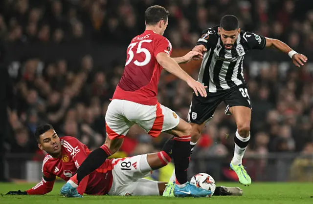 Tarik Tissoudali (R) avoids a challenge by Manchester United's Brazilian midfielder #18 Casemiro