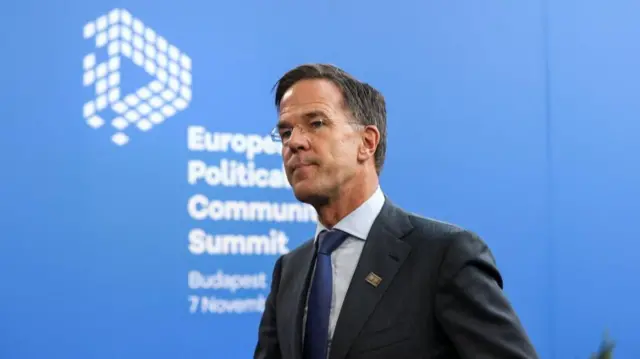 Mark Rutte against a sign reading 'European Political Community Summit'