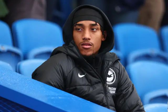 Joao Pedro of Brighton & Hove Albion takes his seat behind the substitute bench