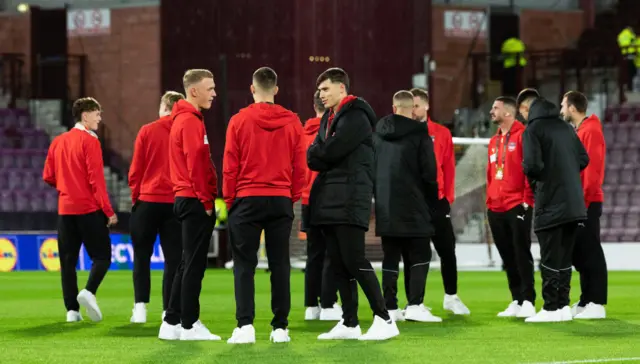 The visiting players out on the Tynecastle pitch earlier