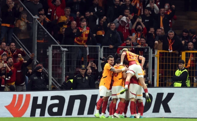 Galatasaray's Yunus Akgun celebrates scoring their first goal with teammates